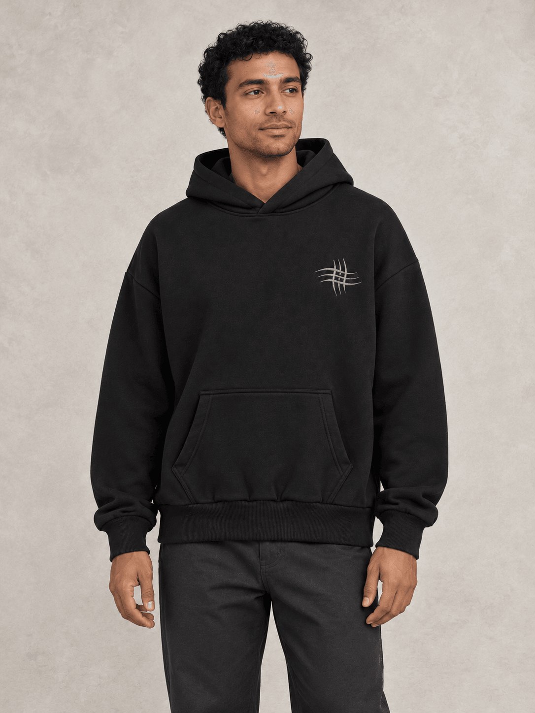 AI-assisted concept of a black pullover hoodie on a model