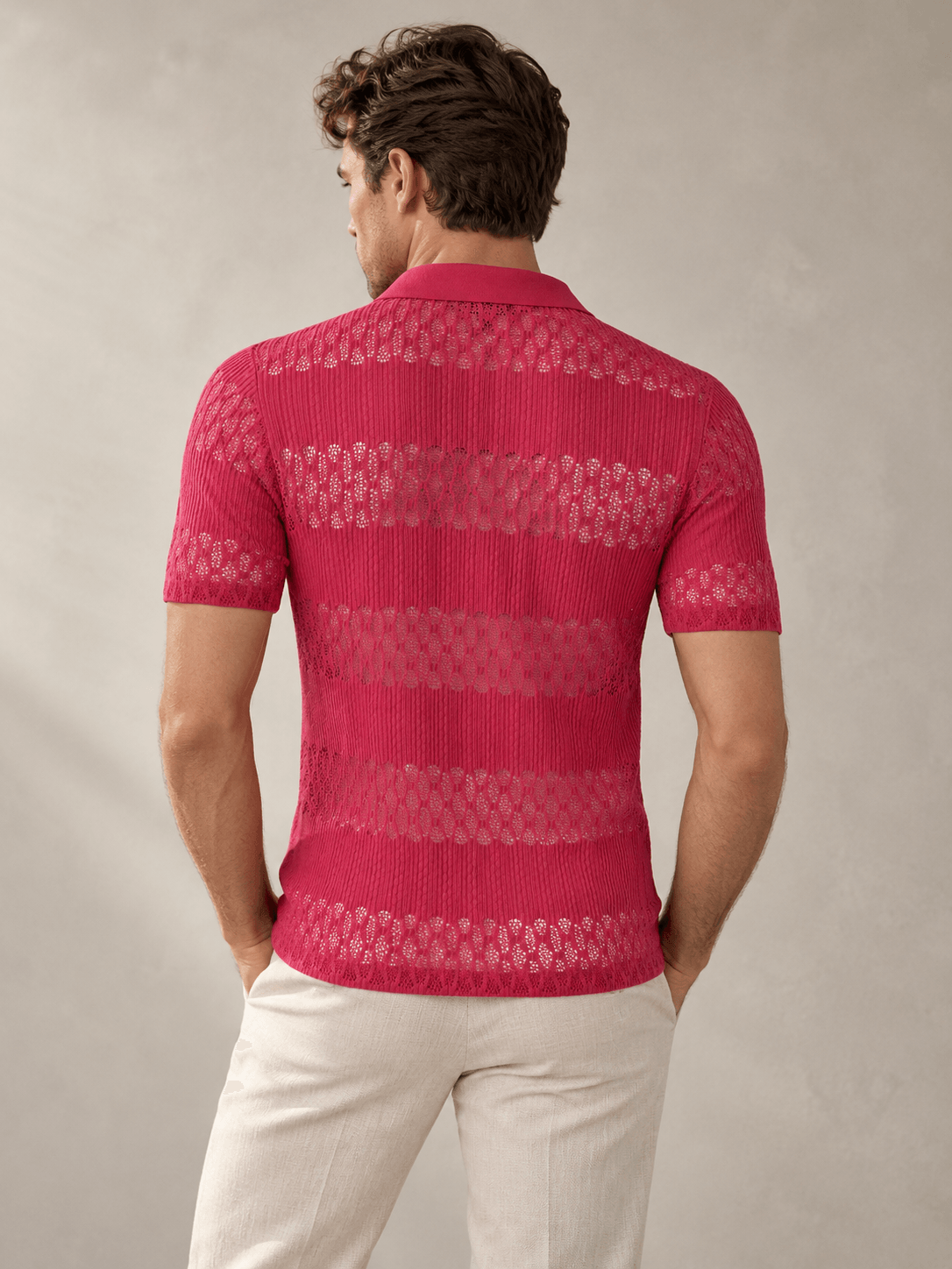 AI-assisted concept showing the back of a raspberry knitted polo