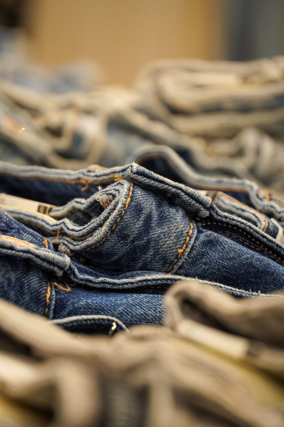 Close-up of indigo denim with textured twill and stitching